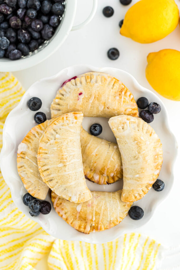 stacked turnovers on white plate.
