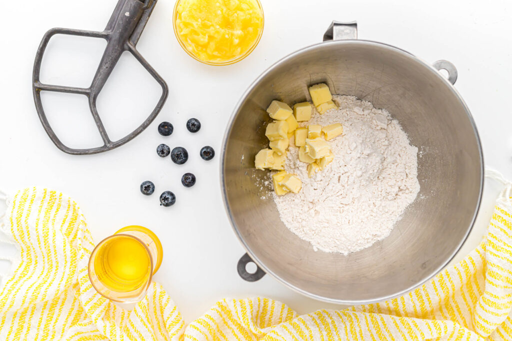 butter and flour in mixing bowl.