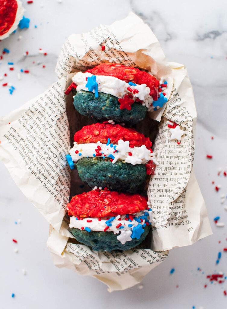 These Oatmeal Cookie Sandwiches are a fun holiday treat! Soft, chewy cookie filled with a sweet buttercream frosting!
