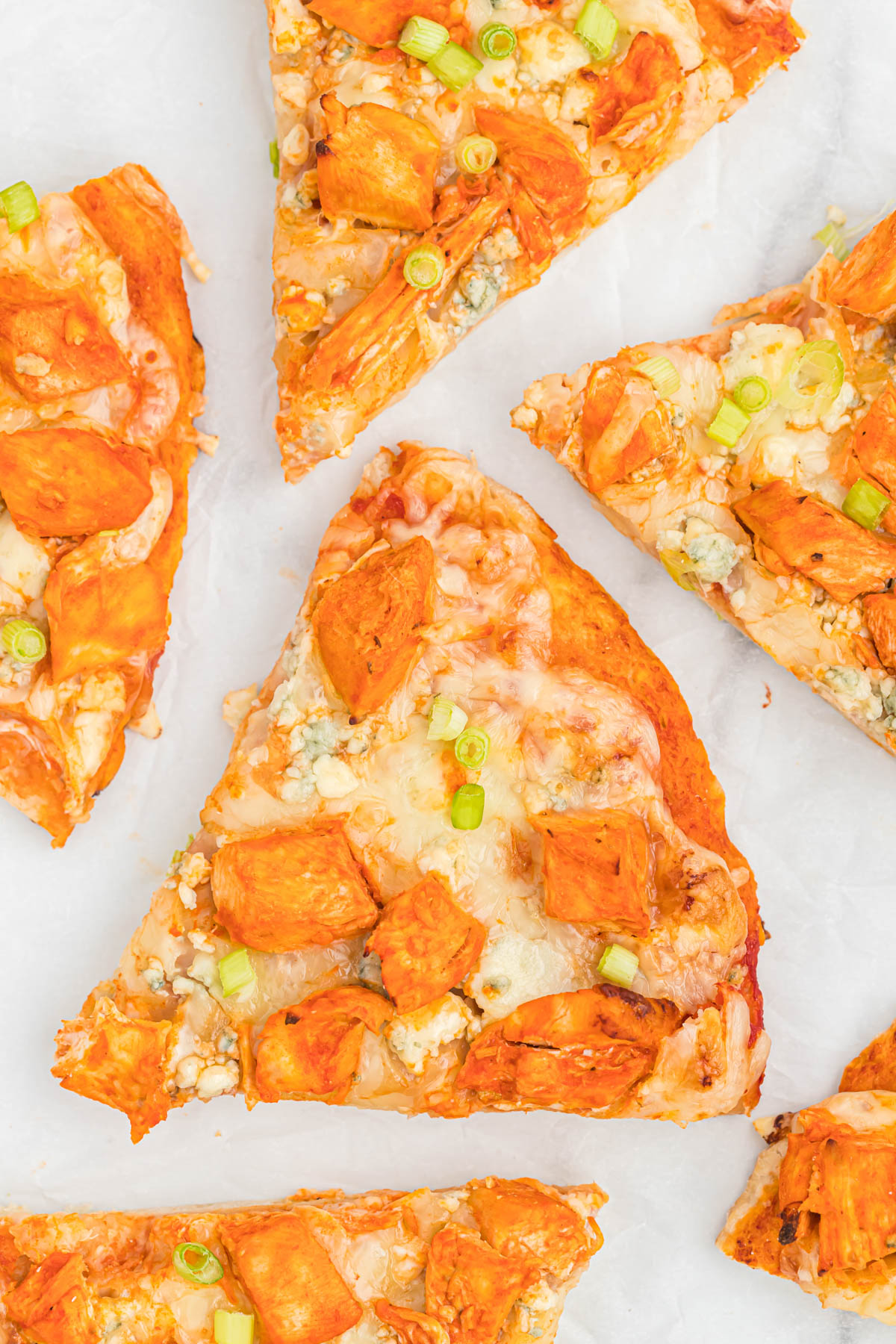 slices of pizza on parchment paper.