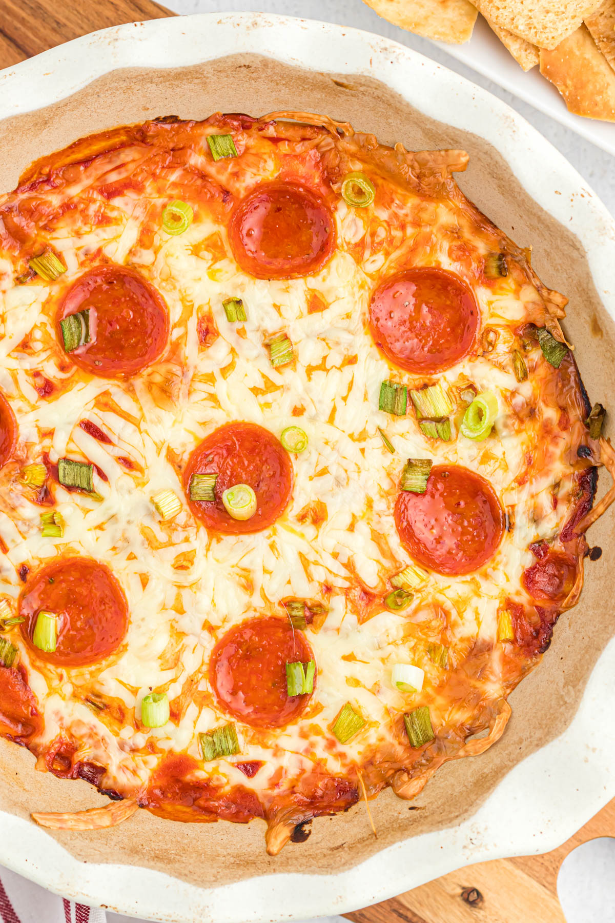 This ooey, gooey Easy Pepperoni Pizza Dip will satisfy any afternoon craving! Once you try this it will be a family favorite! overhead view of Pepperoni Pizza Dip.
