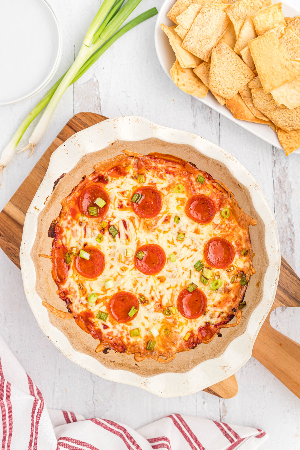 This ooey, gooey Easy Pepperoni Pizza Dip will satisfy any afternoon craving! Once you try this it will be a family favorite! overhead view of cooked dip.