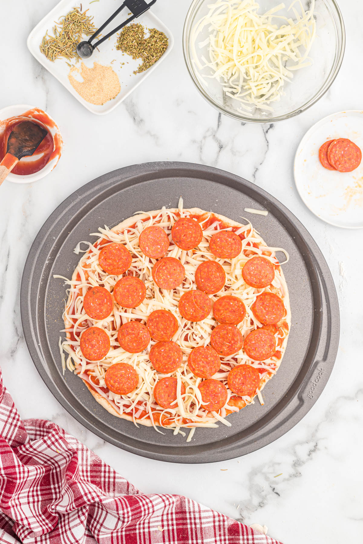 This homemade Pizza Dough recipe is perfect for any pizza night! Comes together in just a few minutes with just a few ingredients! Pizza Dough before baking on pizza pan.
