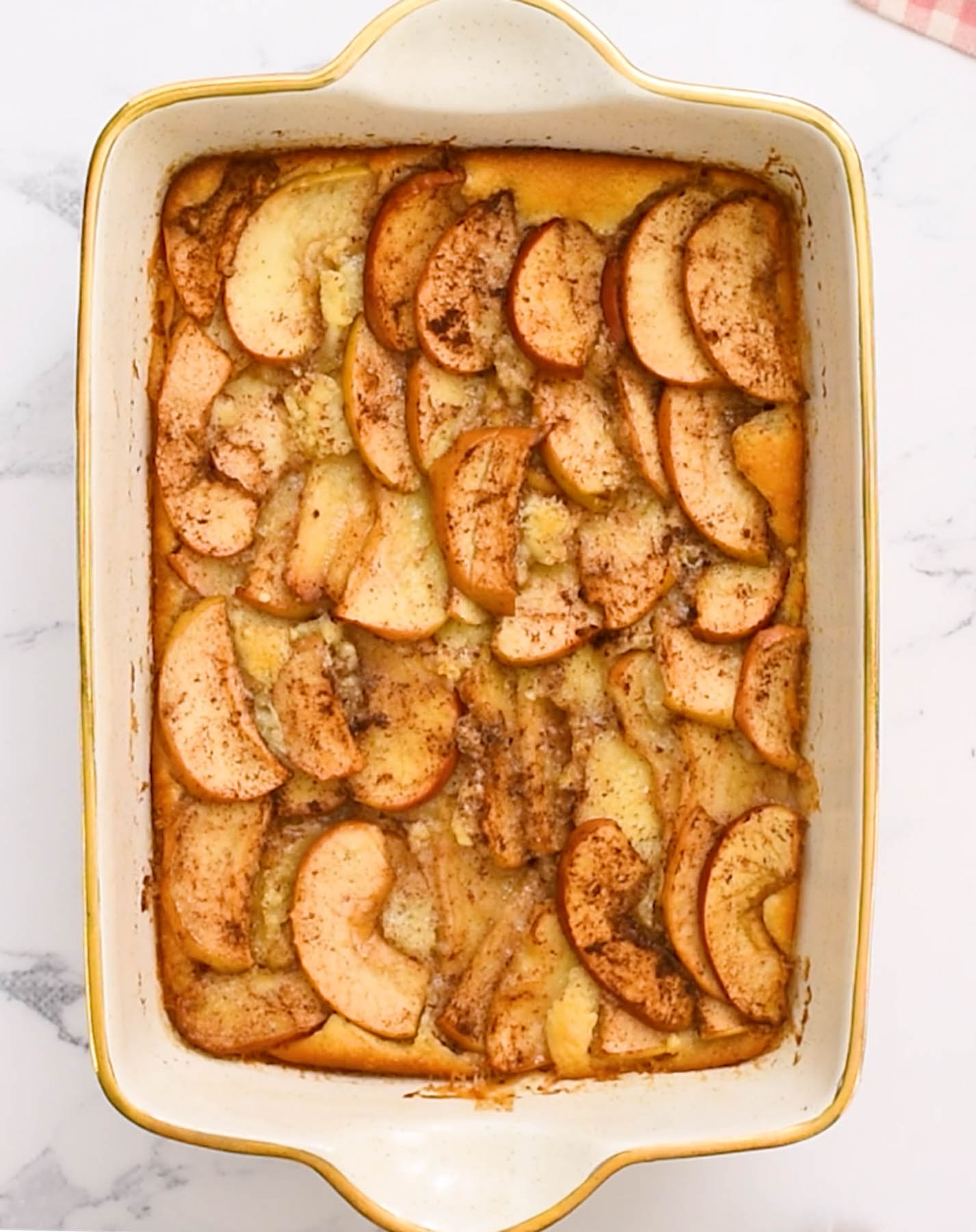 Easy Apple Cobbler that is so simple to make! Filled with the warm spice of cinnamon, embedded in a cake-like buttery topping! overhead view of apple cobbler