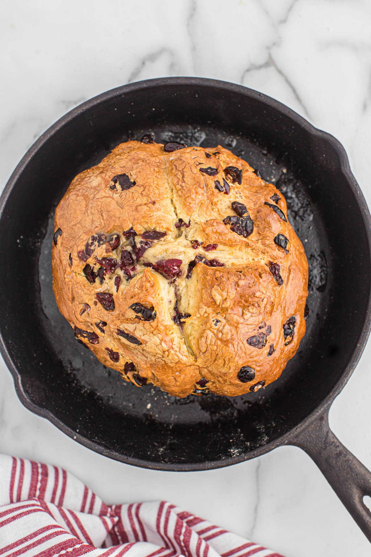 overhead view of cranberry soda bread in skillet