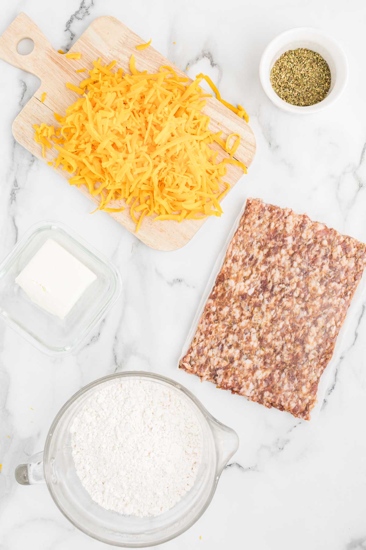 Ingredients for Air fryer sausage balls on white background.
