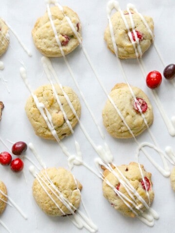 Cranberry White Chocolate Chip Cookies drizzled with white chocolate.