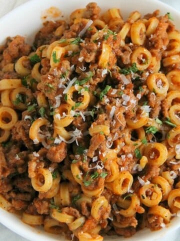 Homemade Spaghetti O's in white bowl