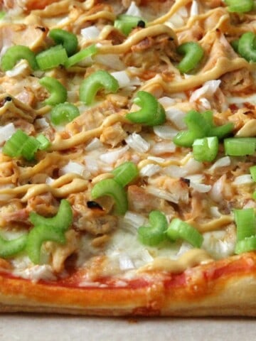 Puff Pastry Honey Mustard Chicken Pizza on parchment paper