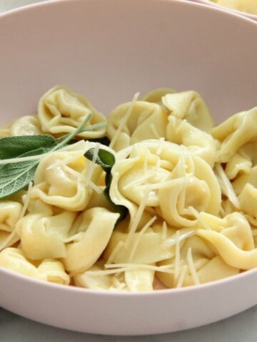 Tortellini with Butter and Sage in light pink bowl