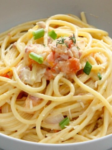 Bucatini with Tomatoes in grey bowl