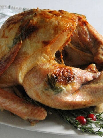 Butter Rosemary Roasted Turkey on white plate