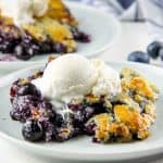 Blueberry Cobbler on white plate with ice cream