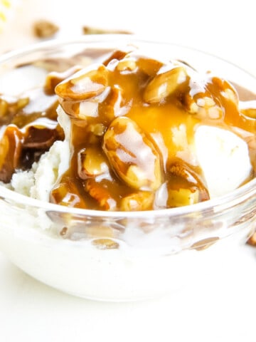Butter Pecan Sauce in glass bowl over ice cream