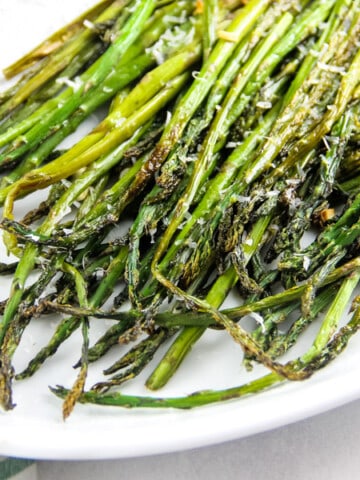 Sheet Pan Roasted Asparagus on white platter