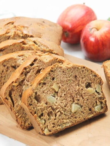 Apple Zucchini Bread sliced on brown cutting board