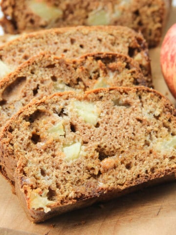 Caramel Apple Bread on brown cutting board in slices