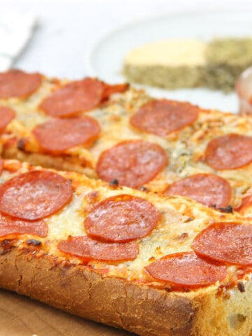 Pepperoni French Bread Pizza cooked on cutting board