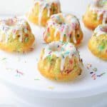 Funfetti Mini Bundt Cakes with 6 cakes on white cake plate