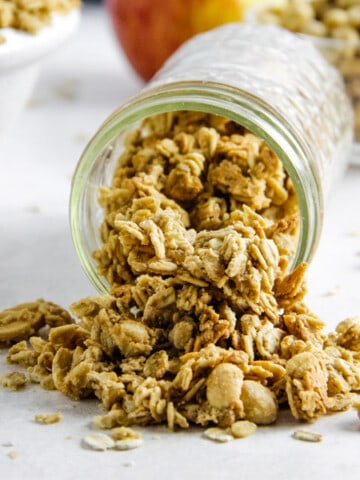 granola spilling out of mason jar.