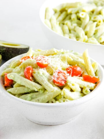Avocado Pasta in bowl topped with cheese