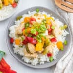 stir fry on gray plate.