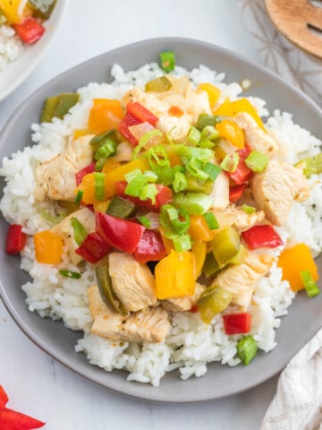 stir fry on gray plate.