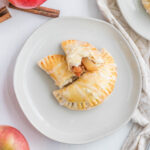 cooked turnovers on white plate.