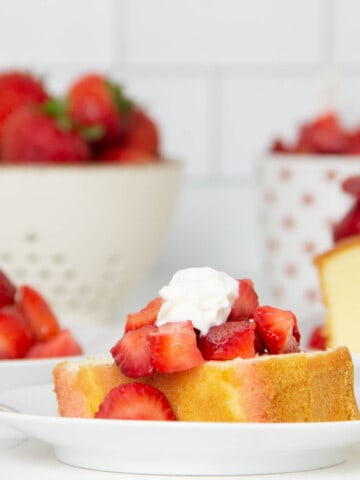 Easy Strawberry Sauce Recipe on pound cake topped with whipped cream.