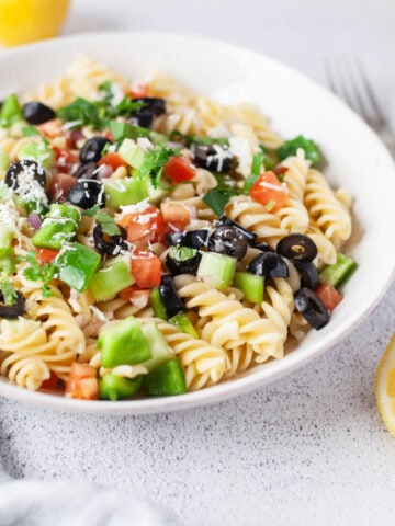 Greek Pasta Salad in white bowl.
