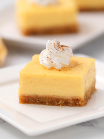 piece of cheesecake on white plate.
