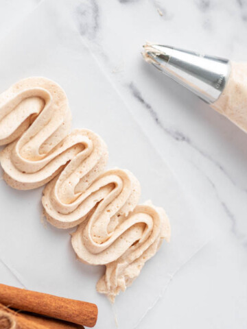 Cinnamon Buttercream Frosting with piping bag and tip.
