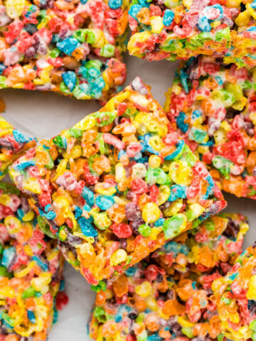 Fruity Pebbles Rice Krispie Treats stacked on each other.