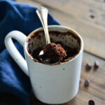 chocolate cake in cup with spoon.
