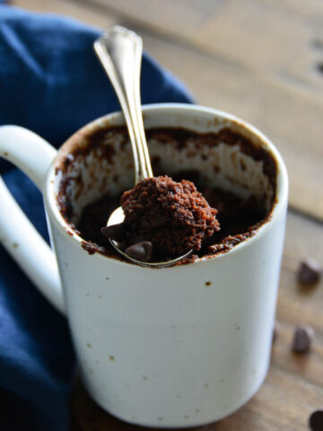 chocolate cake in cup with spoon.