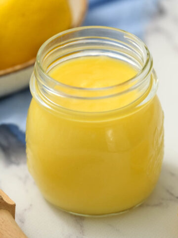 Homemade Lemon Curd in glass jar.