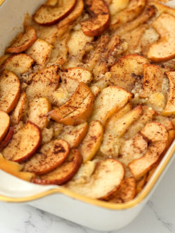 apple cobbler in white dish.