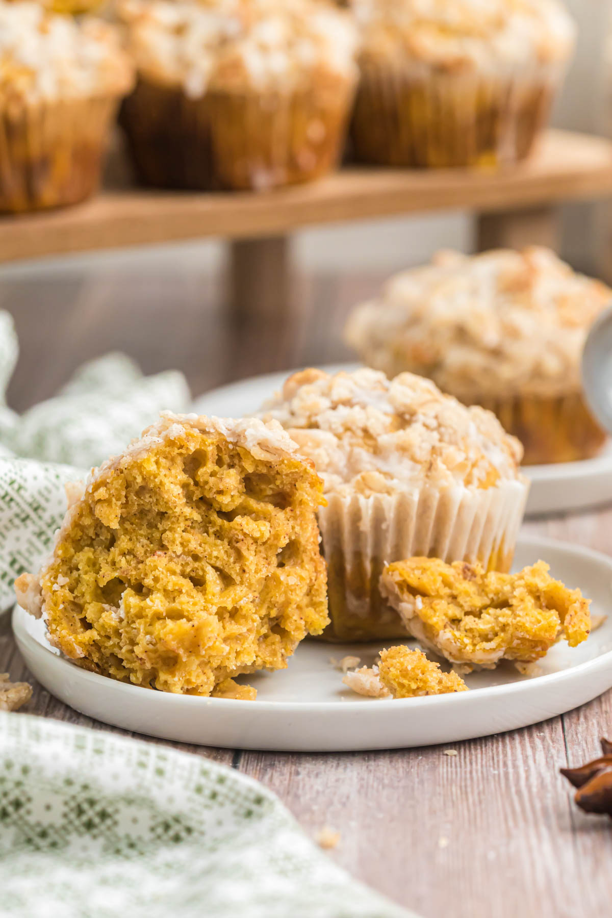 bite out of Pumpkin Oatmeal Muffins on white plate.