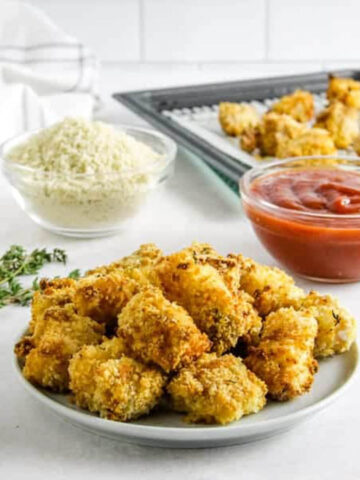 fish nuggets on white plate.